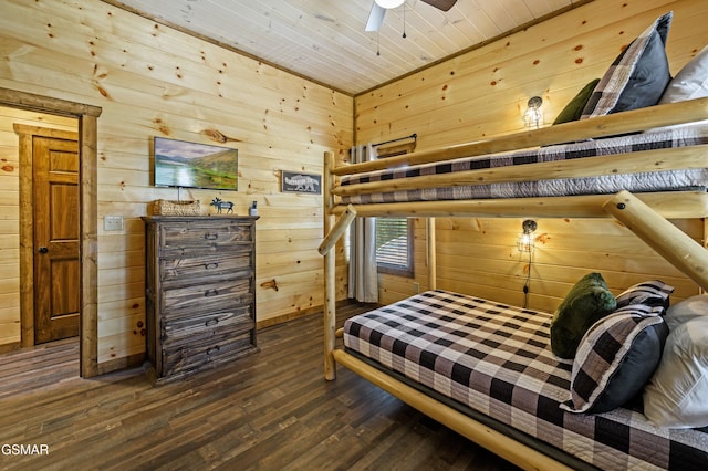 bedroom featuring wood ceiling, dark hardwood / wood-style flooring, and wood walls