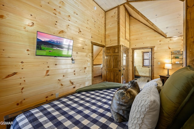 bedroom with high vaulted ceiling and wood walls