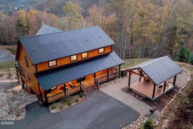 2229 Legend Dr, Sevierville, TN 37876 - back of house with a porch, a forest view, and a metal roof