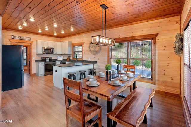 2229 Legend Dr, Sevierville, TN 37876 - dining room with wood walls, light wood-style flooring, a chandelier, wood ceiling, and recessed lighting