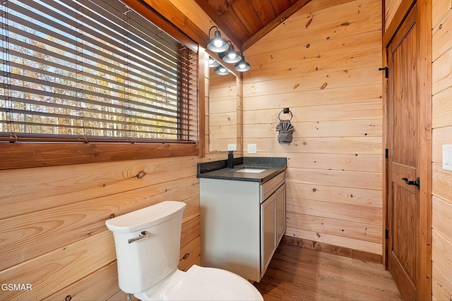 2229 Legend Dr, Sevierville, TN 37876 - bathroom featuring vanity, wood walls, wood finished floors, and wood ceiling