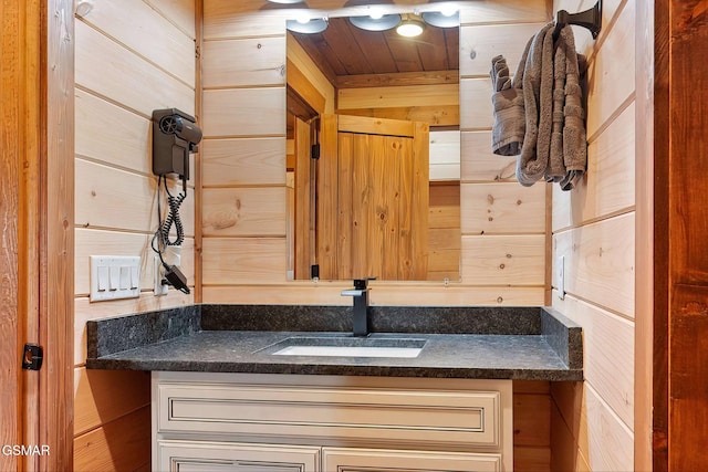 2229 Legend Dr, Sevierville, TN 37876 - bathroom with vanity, wooden ceiling, and wood walls