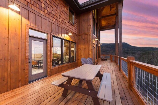 deck at dusk with a mountain view