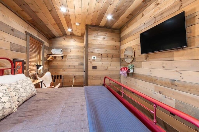 bedroom with wooden ceiling, wooden walls, and vaulted ceiling