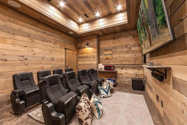 home theater featuring wooden ceiling and wooden walls