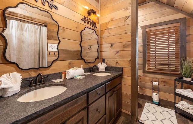 bathroom featuring vanity, wooden ceiling, and wooden walls