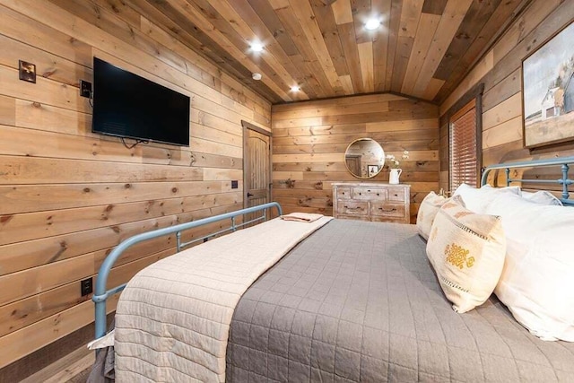 bedroom with lofted ceiling, wooden walls, and wooden ceiling