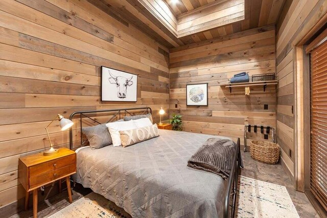 bedroom with wooden walls and wooden ceiling