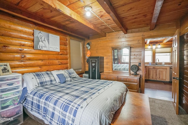 carpeted bedroom with beamed ceiling, wood ceiling, log walls, and a sink