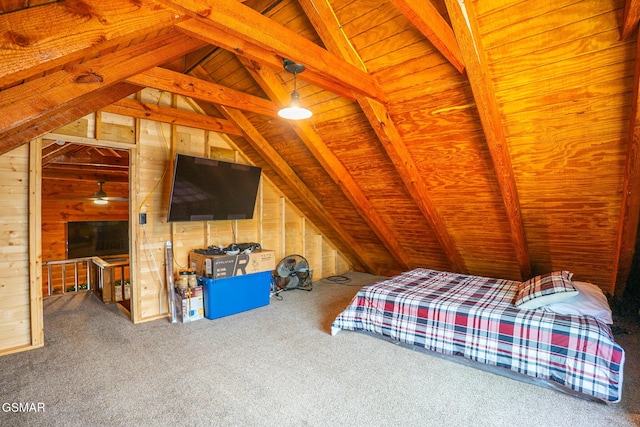 bedroom with wooden walls, vaulted ceiling with beams, and carpet