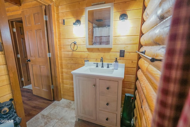 full bathroom with wood walls, vanity, and a shower with curtain