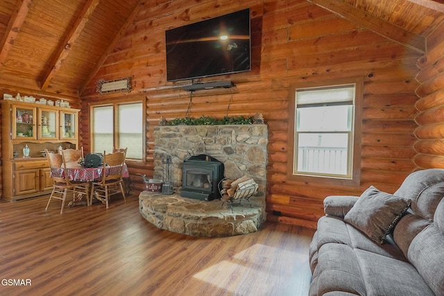 living room featuring beamed ceiling, a healthy amount of sunlight, wooden ceiling, and wood finished floors