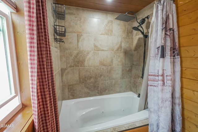 bathroom featuring shower / tub combo with curtain and wood walls