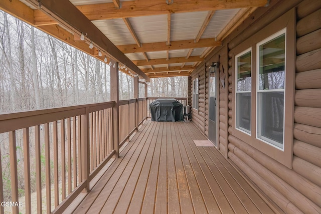 wooden terrace featuring grilling area