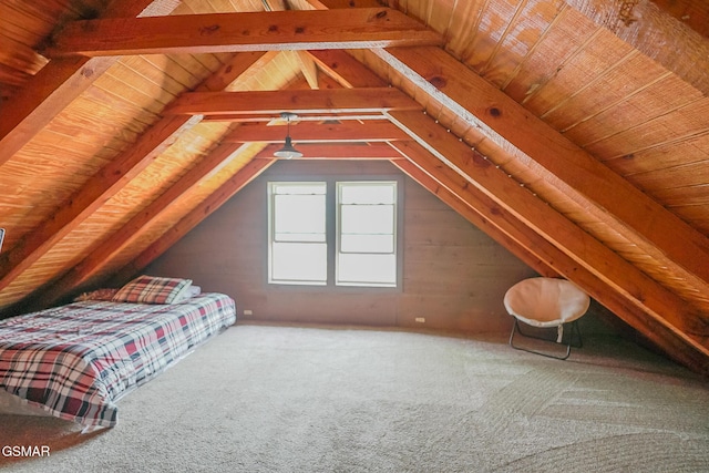 unfurnished bedroom featuring lofted ceiling with beams and wood ceiling