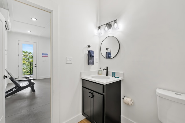 bathroom featuring vanity and toilet