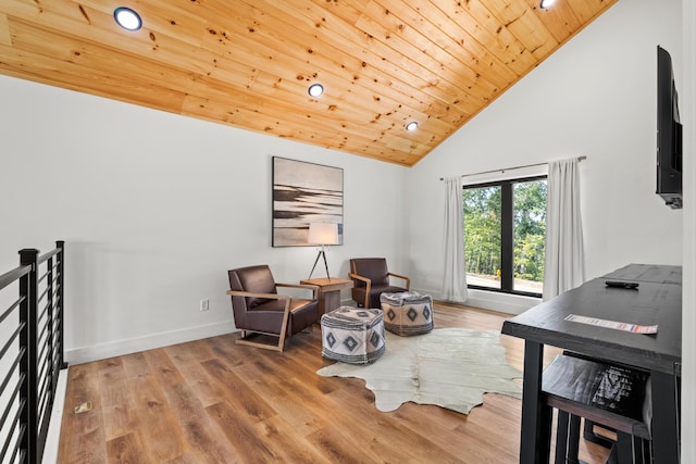 sitting room with wood-type flooring, wooden ceiling, and high vaulted ceiling