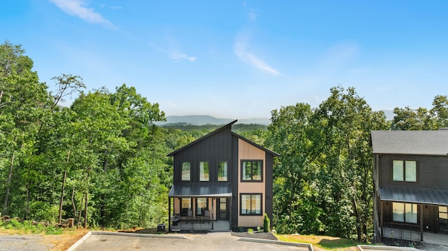 view of front of house featuring a mountain view and a porch