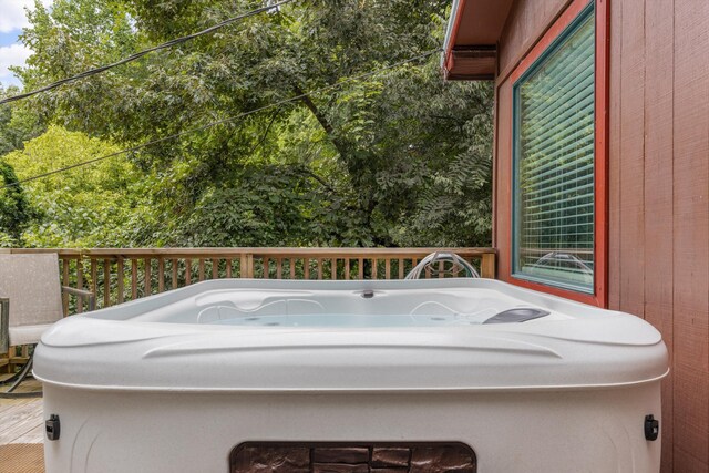 deck featuring a hot tub