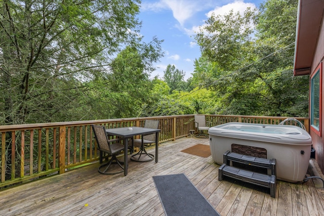 wooden terrace with a hot tub