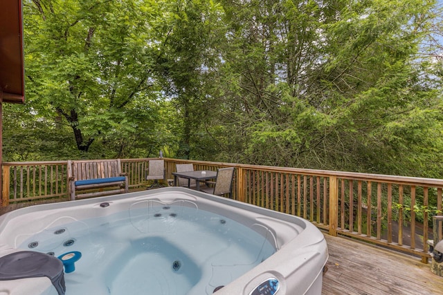 view of pool featuring a deck and a hot tub