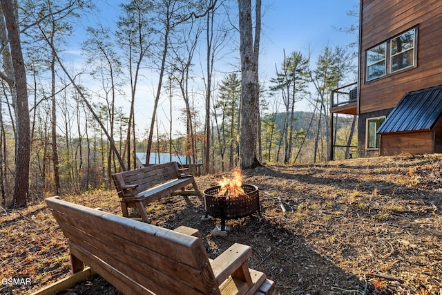 view of yard with an outdoor fire pit