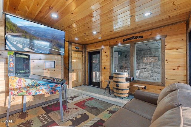 interior space with carpet floors, recessed lighting, wood ceiling, and wood walls