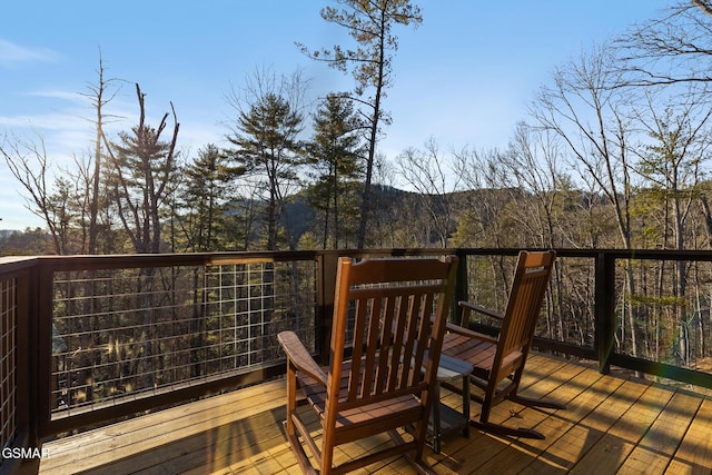 wooden terrace with a forest view