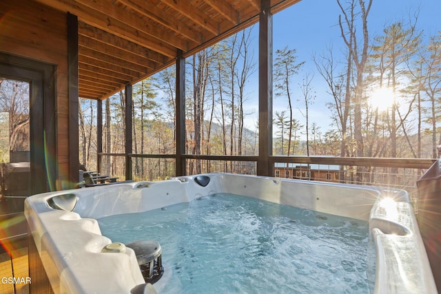 sunroom / solarium featuring a jacuzzi