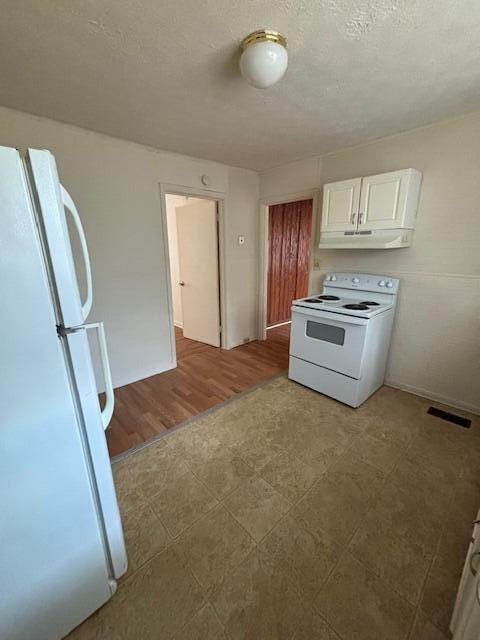 kitchen featuring a textured ceiling, white appliances, extractor fan, light hardwood / wood-style floors, and white cabinetry