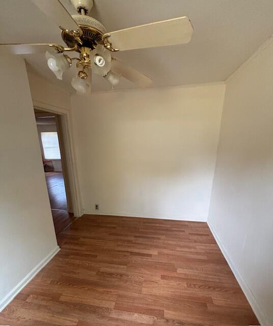 unfurnished room with wood-type flooring and ceiling fan