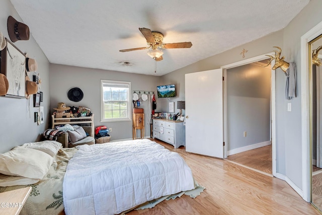 bedroom featuring ceiling fan and light hardwood / wood-style floors