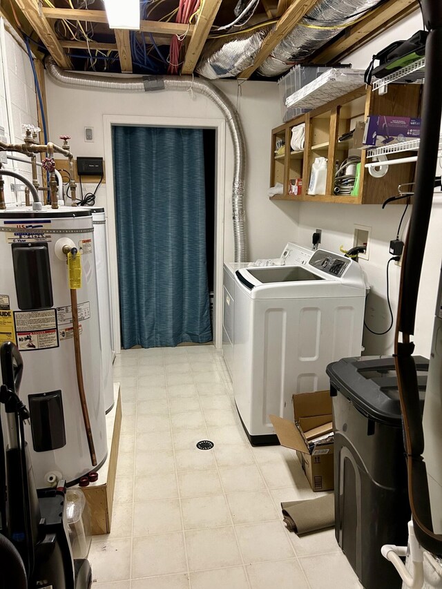 clothes washing area with water heater and independent washer and dryer