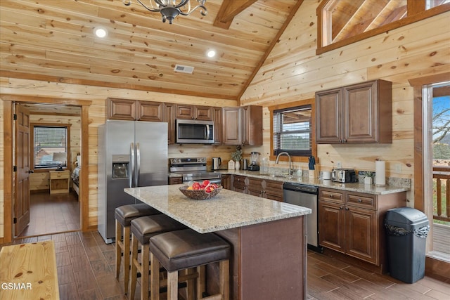 3316 Grace Way, Sevierville, TN 37876 - kitchen featuring stainless steel appliances, wood finish floors, a sink, vaulted ceiling, and wood ceiling