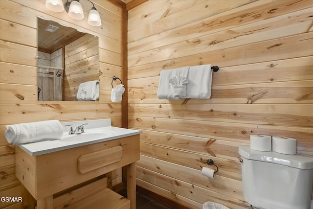 3316 Grace Way, Sevierville, TN 37876 - bathroom featuring wooden walls, toilet, and vanity