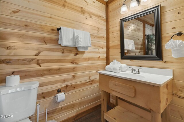 3316 Grace Way, Sevierville, TN 37876 - bathroom featuring wood walls, toilet, and vanity