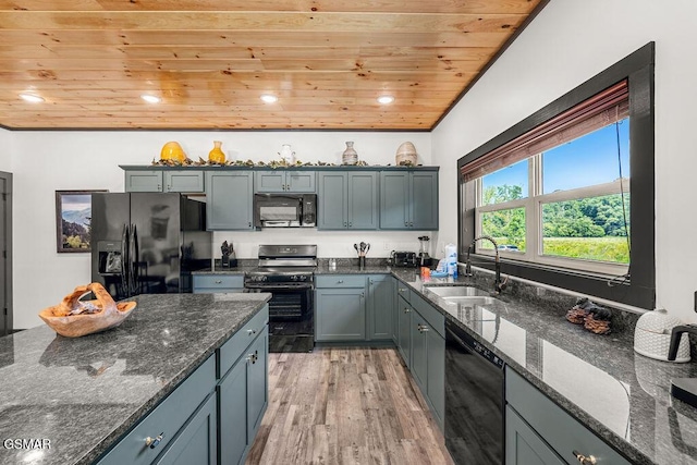 1105 Center St # 3, Sevierville, TN 37862 - kitchen with black appliances, wood ceiling, light wood finished floors, dark stone counters, and recessed lighting