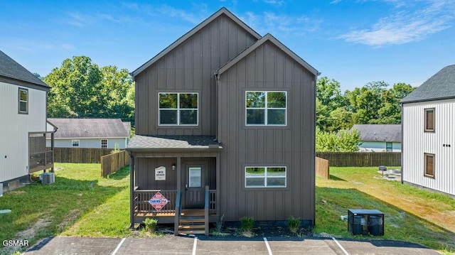 1105 Center St # 3, Sevierville, TN 37862 - back of house featuring board and batten siding, uncovered parking, and a shingled roof