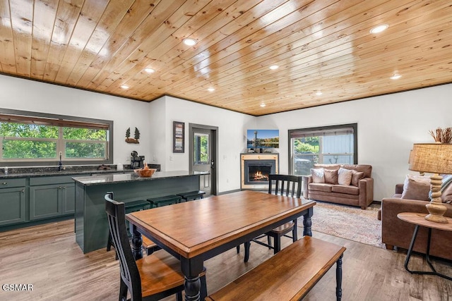 1105 Center St # 3, Sevierville, TN 37862 - dining area with wood ceiling, a lit fireplace, light wood-style floors, and recessed lighting