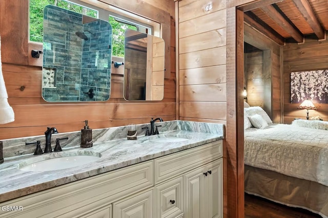 4427 Stackstone Rd, Sevierville, TN 37862 - bathroom with ensuite bath, wood walls, and double vanity