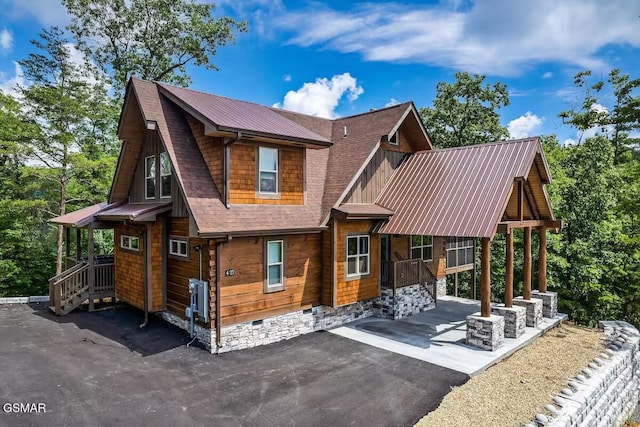 4427 Stackstone Rd, Sevierville, TN 37862 - rear view of house with a patio and metal roof