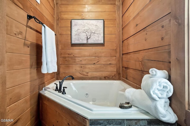 4427 Stackstone Rd, Sevierville, TN 37862 - full bath featuring wood walls and a whirlpool tub