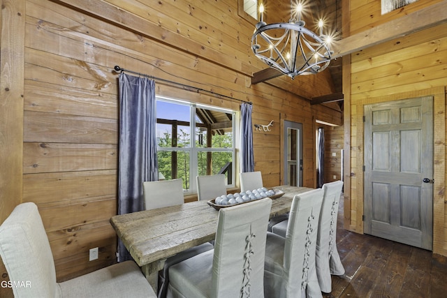 4427 Stackstone Rd, Sevierville, TN 37862 - dining room featuring wooden walls, a chandelier, and dark wood-style flooring