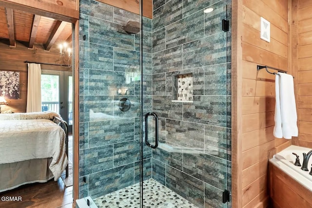 4427 Stackstone Rd, Sevierville, TN 37862 - bathroom featuring ensuite bathroom, wood finished floors, a shower stall, wooden ceiling with exposed beams, and wooden walls