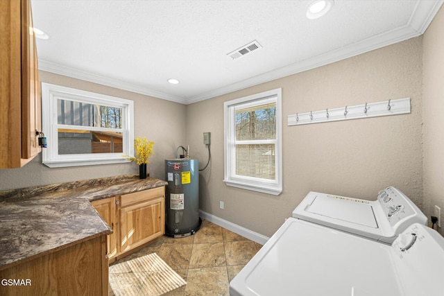 clothes washing area featuring visible vents, electric water heater, crown molding, baseboards, and washing machine and dryer