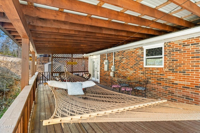 wooden deck with outdoor dining space