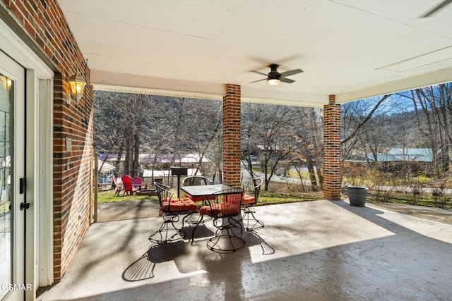 view of patio / terrace featuring outdoor dining area and a ceiling fan