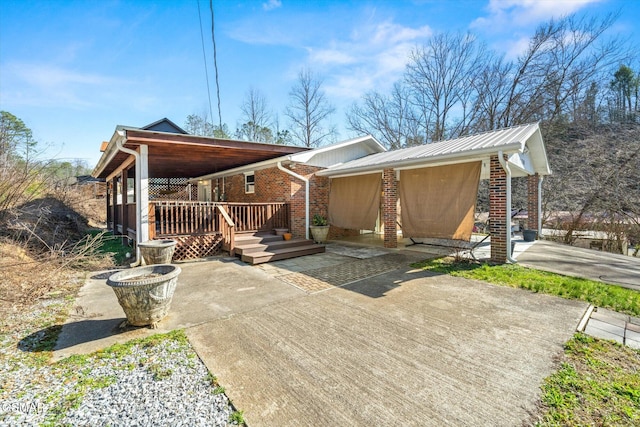 back of house featuring brick siding