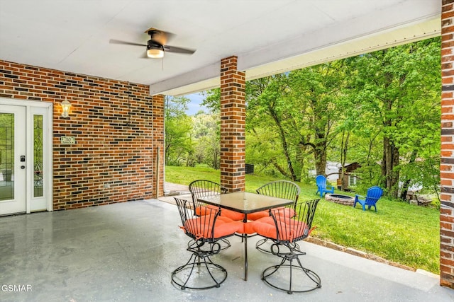 view of patio with outdoor dining area and ceiling fan