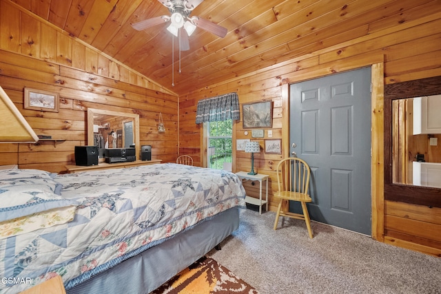 carpeted bedroom featuring vaulted ceiling, wooden walls, and wooden ceiling